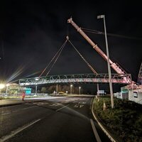 1,000t crane places bridge over road image