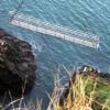 Replica tubular bridge installed on dramatic coastal path image