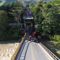 Two people killed by Colombian bridge collapse logo 