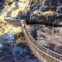 Peruvian gorge spanned with newly woven bridge logo 