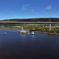 Bridge span comes sailing up river logo 