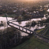 Hockey stick bridge links two green spaces on UK river logo 