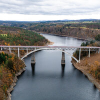 316m concrete arch bridge takes Czech railway over reservoir logo 