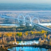 Bridge with O-shape towers links Chinese hubs logo Bridge with O-shape towers links Chinese hubs logo